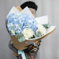 Compliment bouquet with blue Hydrangeas and white Dianthus